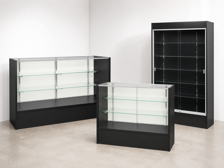 Three black Fullvision retail display cases arranged in a white showroom with concrete flooring